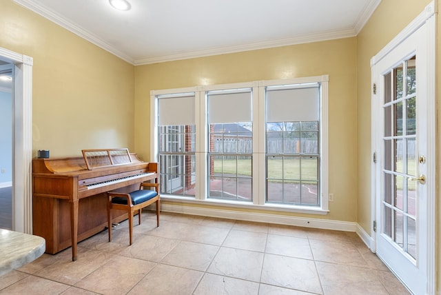 miscellaneous room with light tile patterned floors and crown molding