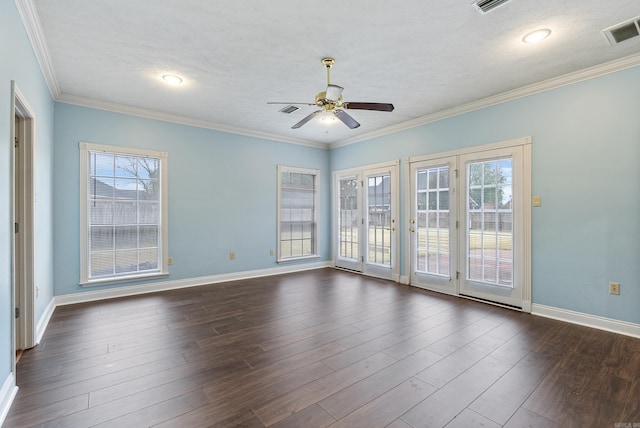 empty room featuring ceiling fan, crown molding, dark wood-type flooring, and a textured ceiling