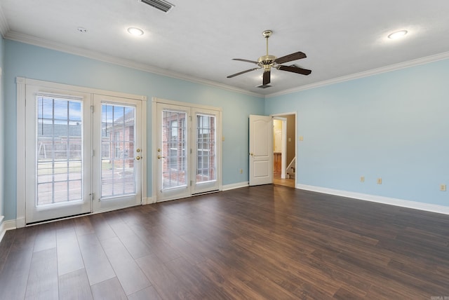 empty room with ceiling fan, crown molding, and dark wood-type flooring