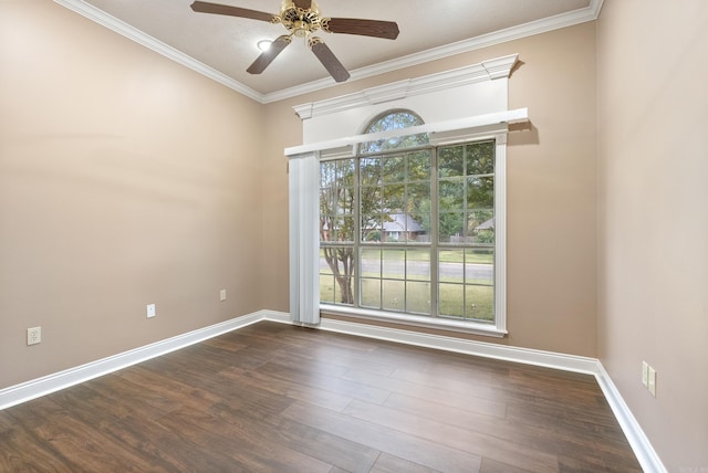 empty room with ceiling fan, ornamental molding, and dark wood-type flooring