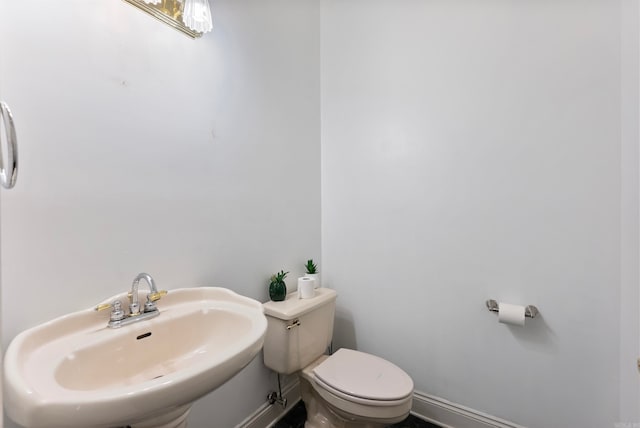 bathroom featuring sink and toilet