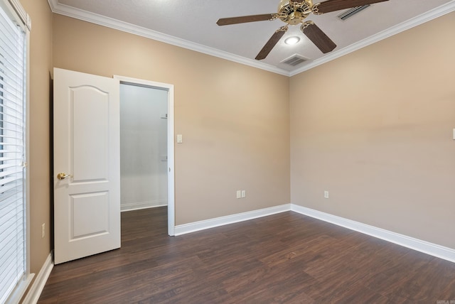 unfurnished room with ceiling fan, dark hardwood / wood-style flooring, and ornamental molding