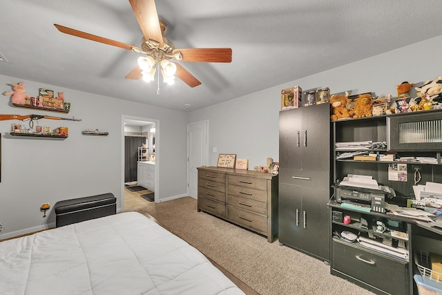 bedroom with carpet flooring, ceiling fan, and a textured ceiling