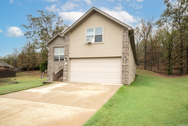 view of property with a front yard and a garage