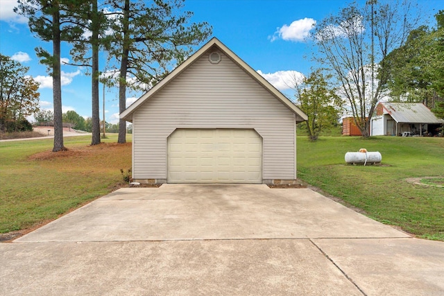 garage featuring a yard