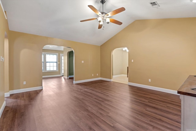 unfurnished living room featuring ceiling fan, dark wood-type flooring, and lofted ceiling