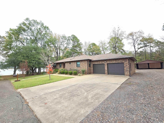 prairie-style house featuring a front yard and a garage