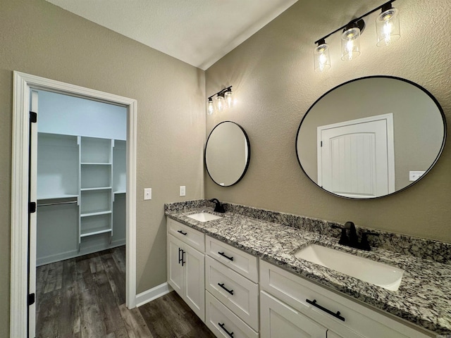 bathroom featuring hardwood / wood-style floors and vanity