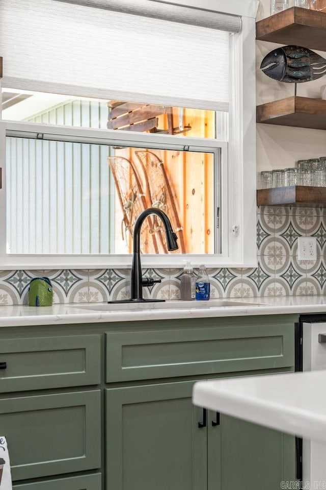 details featuring backsplash and green cabinetry