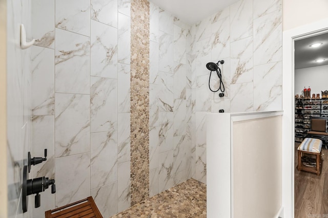 bathroom featuring a tile shower