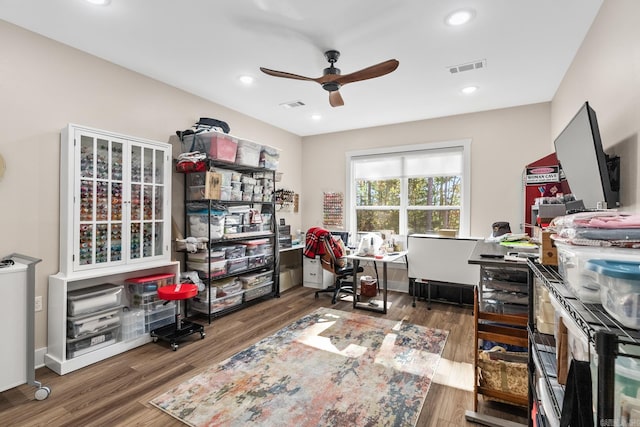 office space featuring dark hardwood / wood-style flooring and ceiling fan