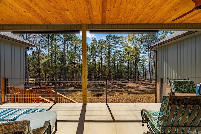 sunroom featuring plenty of natural light and wooden ceiling