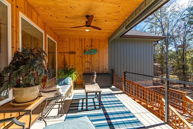 wooden deck featuring ceiling fan and an outdoor hangout area