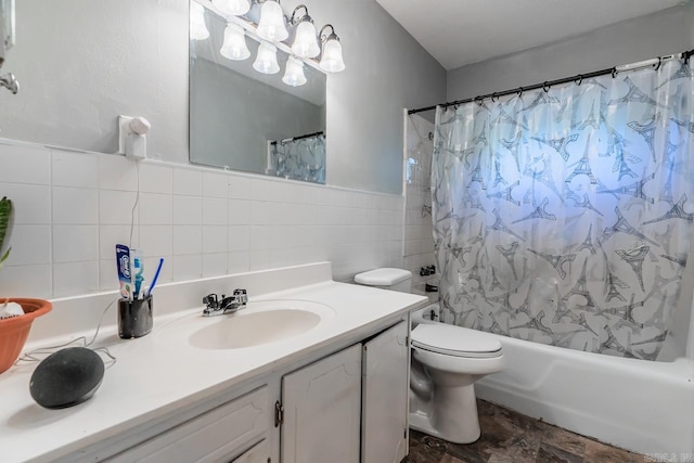 full bathroom with shower / tub combo with curtain, vanity, tile walls, and toilet