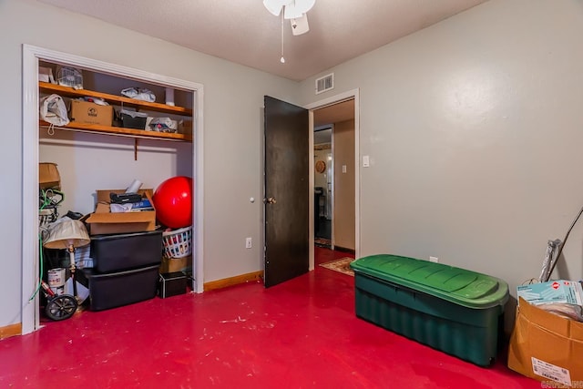 miscellaneous room with ceiling fan and concrete flooring