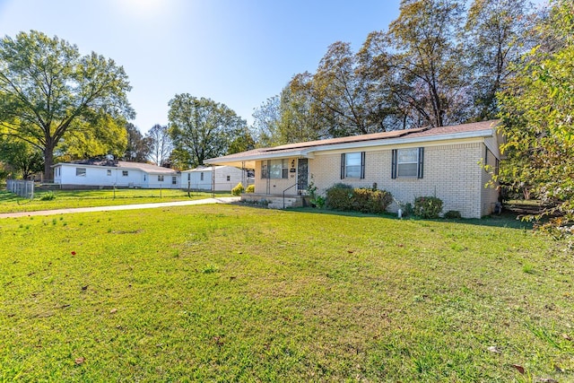 ranch-style house with a front yard