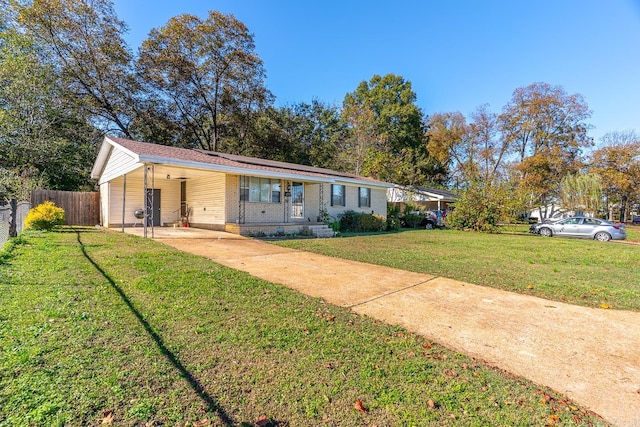 ranch-style home featuring a front yard