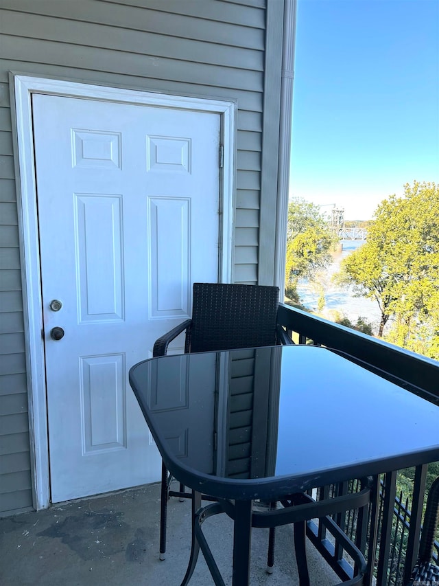 entrance to property with a balcony