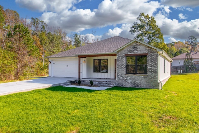 single story home featuring a front lawn, covered porch, and a garage