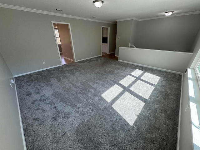 carpeted empty room with ornamental molding