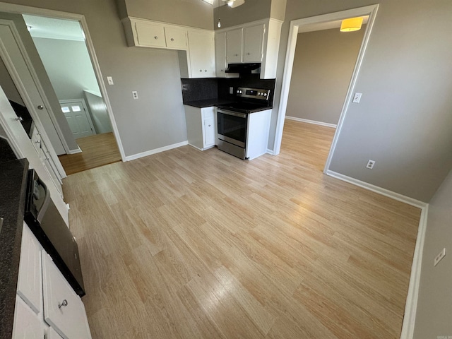 kitchen with decorative backsplash, light wood-type flooring, white cabinetry, and stainless steel range with electric stovetop