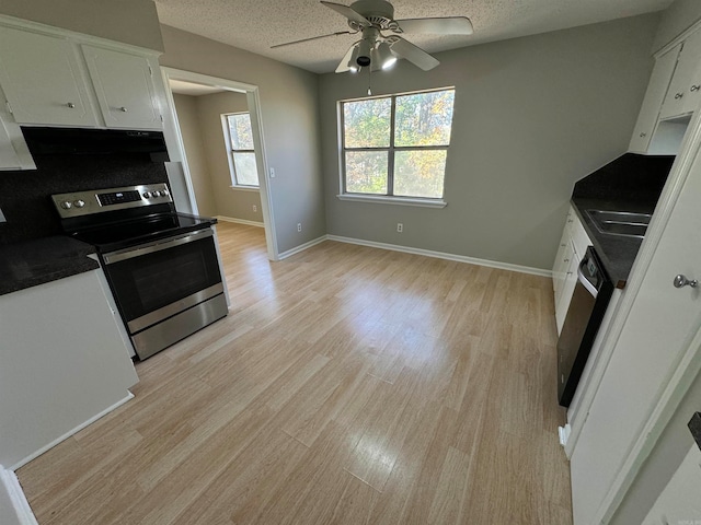 kitchen featuring dishwasher, stainless steel electric range oven, a textured ceiling, light hardwood / wood-style floors, and white cabinetry