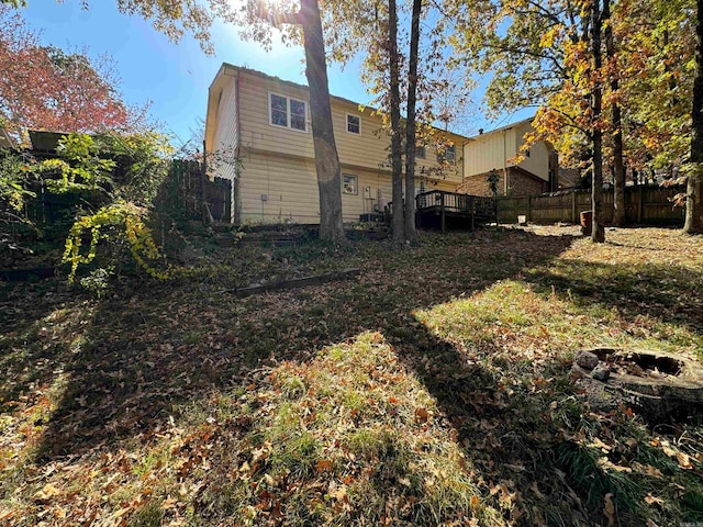 back of property featuring a deck