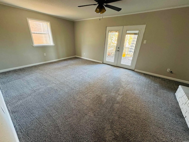 spare room with carpet flooring, ceiling fan, crown molding, and french doors