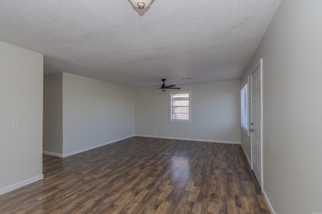 spare room with ceiling fan, dark hardwood / wood-style flooring, and a textured ceiling