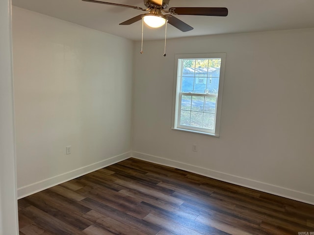 empty room featuring ceiling fan and dark hardwood / wood-style floors