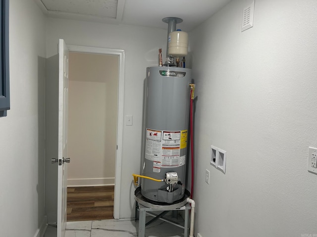 utility room with water heater