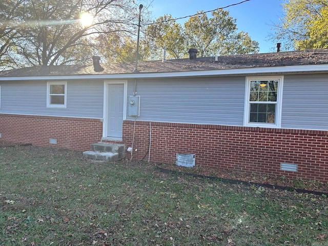 view of property exterior with a yard