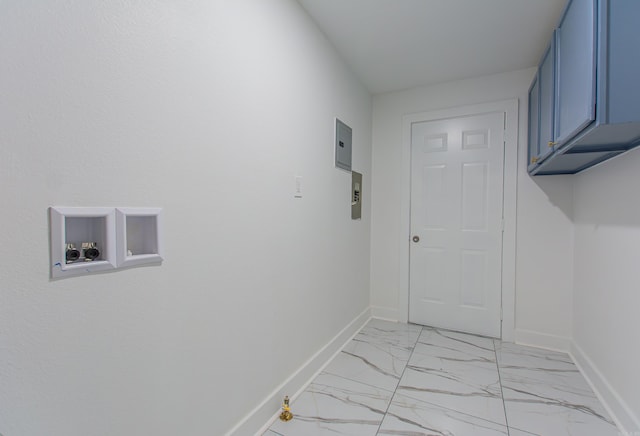 clothes washing area with cabinets and washer hookup