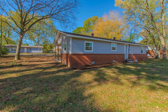 back of house featuring a yard