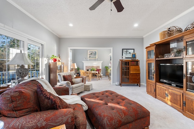 living room with a textured ceiling, light colored carpet, ceiling fan, and ornamental molding