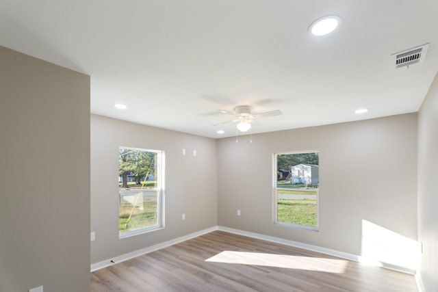 unfurnished room with light hardwood / wood-style flooring and ceiling fan