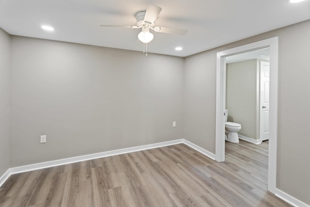 empty room with light hardwood / wood-style flooring and ceiling fan