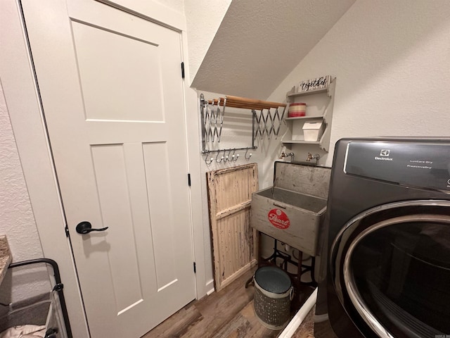 washroom with dark hardwood / wood-style floors and washer / clothes dryer