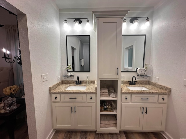 bathroom with vanity and hardwood / wood-style flooring