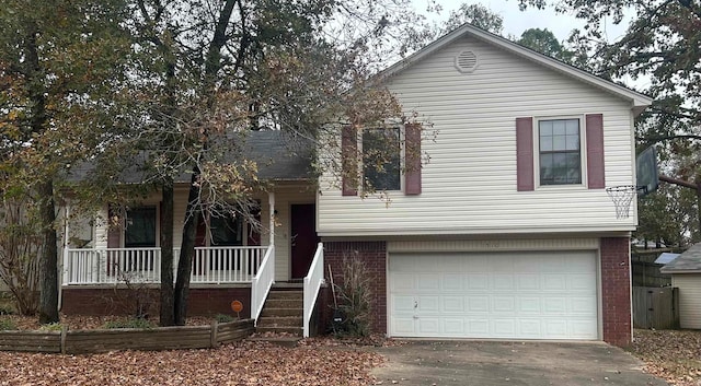 view of front of property with a porch and a garage