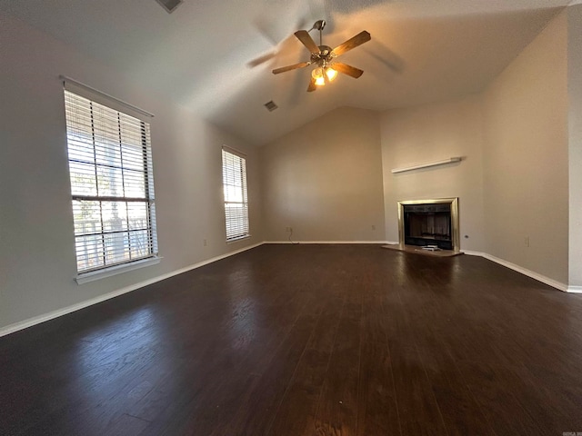 unfurnished living room featuring vaulted ceiling, ceiling fan, and dark wood-type flooring