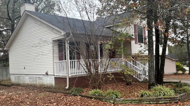 view of property exterior featuring a porch