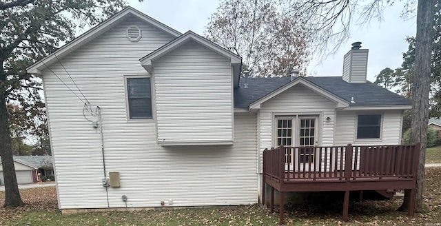 back of house with a wooden deck