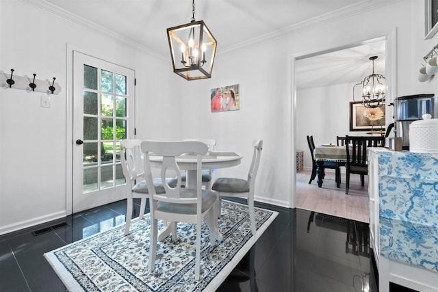 tiled dining room with an inviting chandelier and crown molding