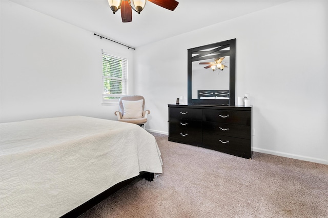 bedroom with light colored carpet and ceiling fan