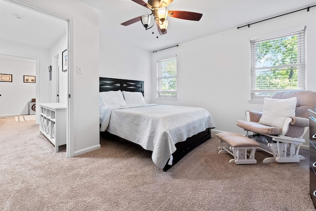 bedroom featuring ceiling fan and carpet floors