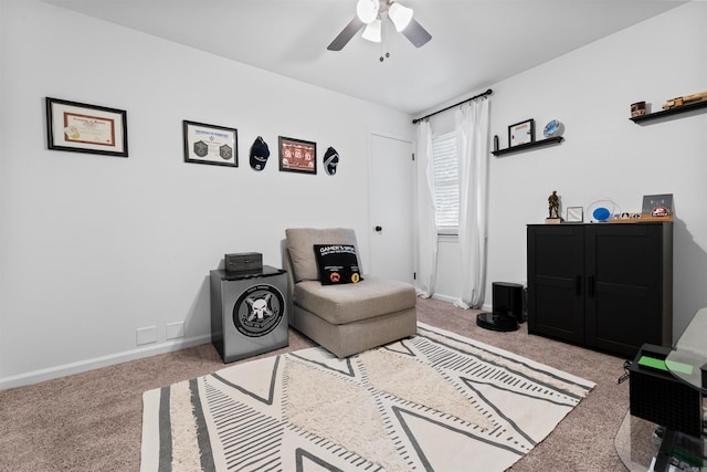 living area featuring ceiling fan and carpet floors