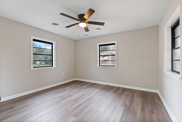 unfurnished room featuring ceiling fan and hardwood / wood-style flooring