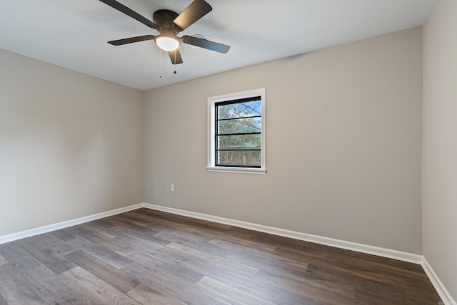 empty room with hardwood / wood-style floors and ceiling fan