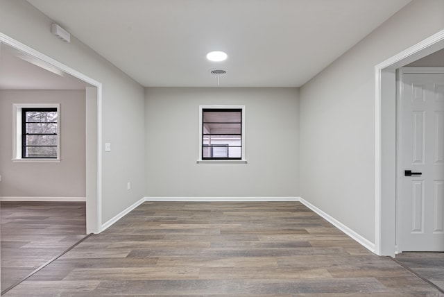 empty room with wood-type flooring